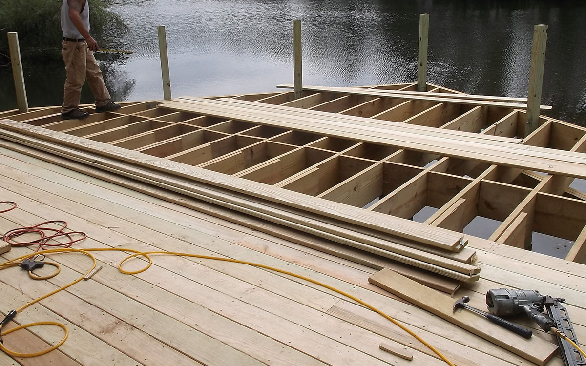 Building a wood deck over the water.