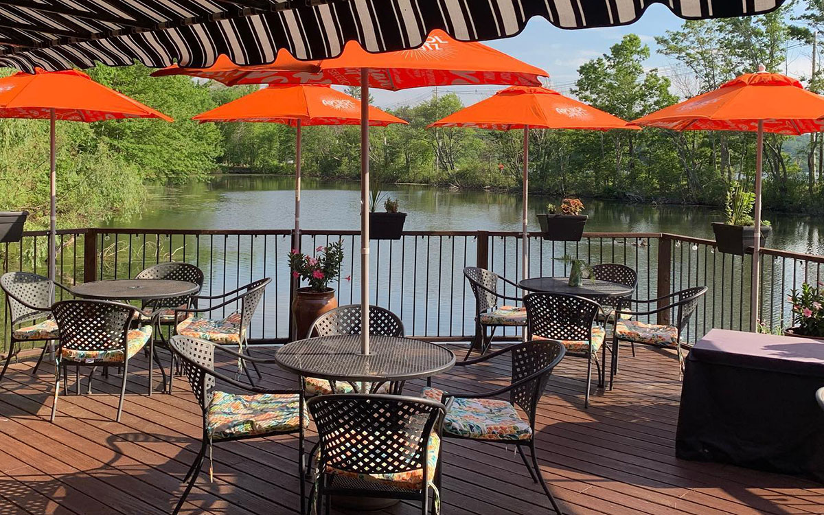 Treated wood deck (PT). Built over the water for a local restaurant. Utilizes helical piles for support. Acton, MA 01720.