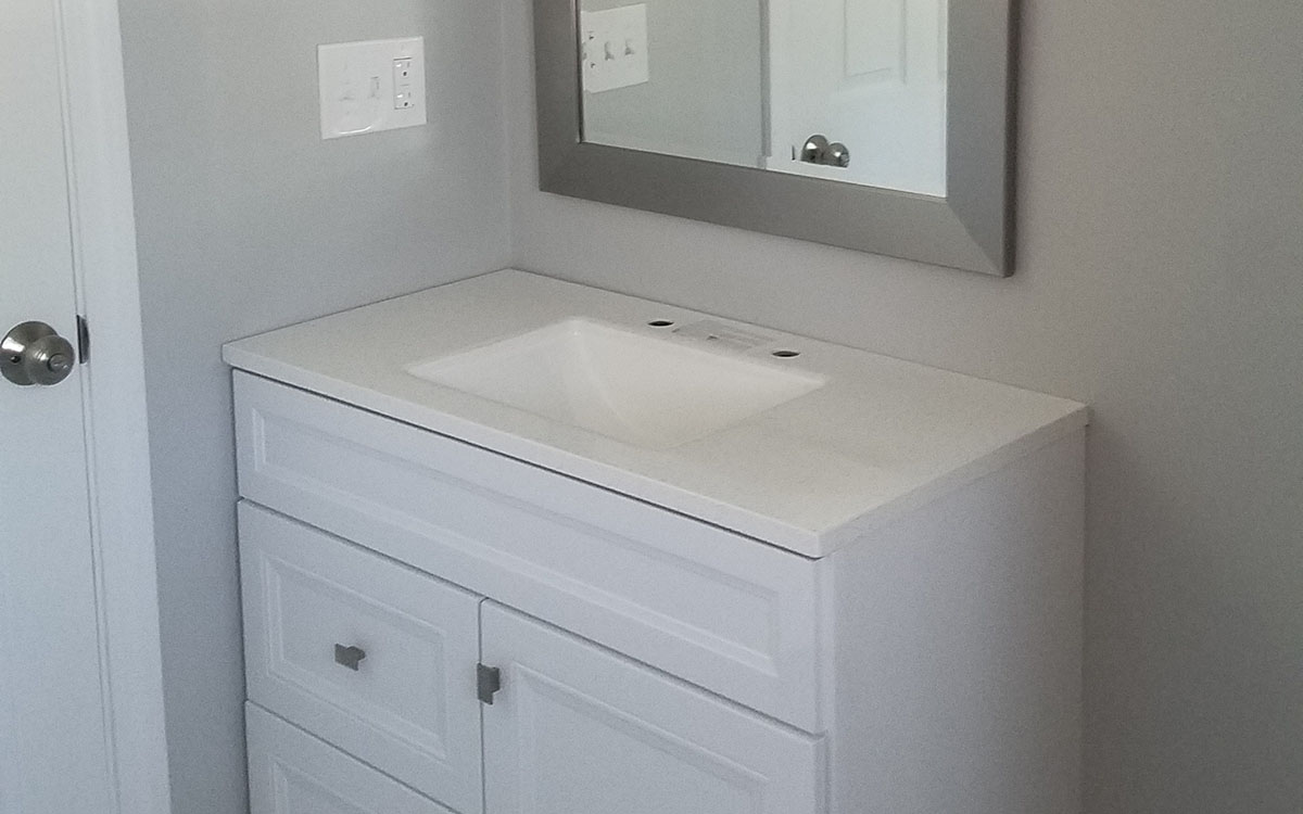 Complete bathroom remodel. Included new layout, moving walls, tile walls and floor, vanity, toilet, bathtub and shower, closet. Milllville, MA 01529.