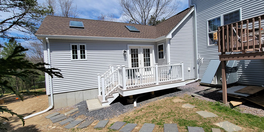 The entrance to the Franklin, MA in-law addition is located at the back of the house. and blends with the existing structure very nicely.